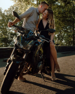 Elopement Photographer, A husband and wife sit on a motorcycle, he kisses her
